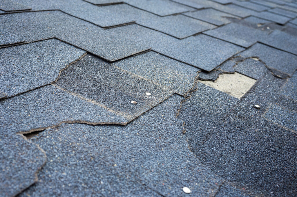 Asphalt Roofing Damage and Repair